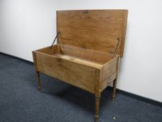 An antique pine farmhouse proving table fitted two drawers