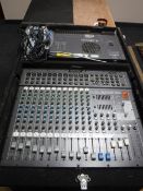 A cased Fender electrics PX-2212D powered mixing console