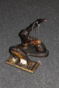 Two antique metal hand painted press stampers (2)
