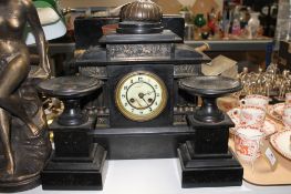 A Victorian slate mantel clock garniture