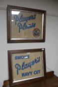 Two Edwardian oak frames containing Players cigarette advertising