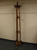 An Edwardian oak hat and coat stand