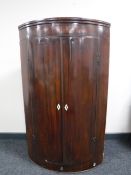 A George II mahogany hanging corner cupboard