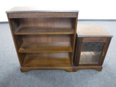 A reproduction oak audio cabinet together with matching bookshelves