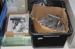 A box containing mixer taps, door handles,