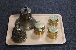 A tray containing three brass fire hydrant caps together with a brass ship's bell and an embossed