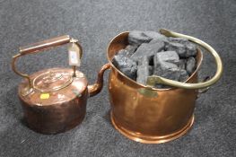 An antique copper and brass kettle together with an antique copper and brass coal bucket