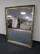 A decorative gilt framed overmantel mirror