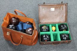 A leather case and leather bag containing four sets of crown green bowls