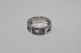 An 18ct gold diamond set ring by Gucci, 10.
