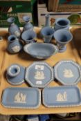 A tray containing fourteen pieces of Wedgwood blue and white jasperware including vases,