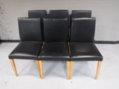 A set of six contemporary black leather dining chairs