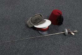 A Fencing foil together with a woollen hat,