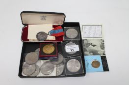 A box of assorted crowns together with a Queen Elizabeth II coronation coin,