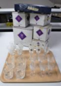 A tray containing twenty Edinburgh International lead crystal glasses with boxes