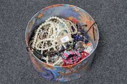 A box of costume jewellery, beads, necklaces etc.