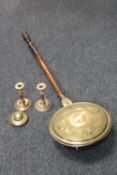 A pair of brass candlesticks together with a trench art brass inkwell and a Victorian brass warming