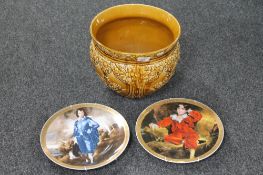 A glazed pottery planter together with two Newcastle wall plates