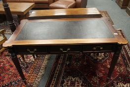 A Victorian mahogany leather topped writing table fitted with three drawers,