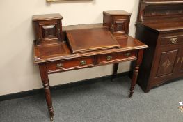 A Victorian mahogany clerk's desk fitted with two drawers,