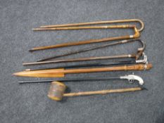 Two bundles of assorted walking sticks including examples with silver mounts,