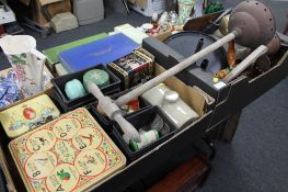 Two boxes of vintage tins, poss sticks, brass hand bell, toasting fork,