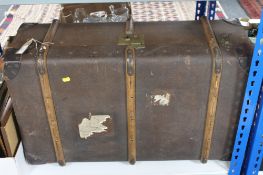 An early twentieth century wooden bound travelling trunk