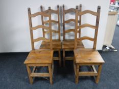 A set of four pine farmhouse ladder backed chairs