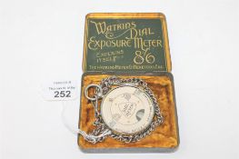 A vintage Watkins Dial Exposure Meter, in original fitted tin.
