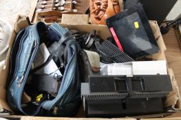 A box of camera equipment, lens, projector,
