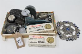 A Waltham Watch Company eight day US aircraft clock, together with a vintage stapler, GB badge,