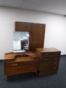 A mid twentieth century oak G-plan three piece bedroom suite