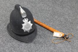A Northumbria police helmet together with a truncheon