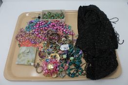 A late Victorian bead work shawl together with costume jewellery