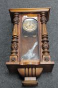 A mahogany cased eight day wall clock with enamelled dial