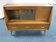 A mid twentieth century teak cocktail sideboard