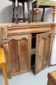 An antique pine press top CONDITION REPORT: Measures 118cm high by 120cm wide by