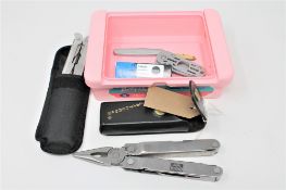 A Leatherman Super tool in pouch,