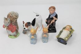 A Royal Doulton figure- Tiny Tim together with a Royal Doulton figure - Terrier with Slipper,