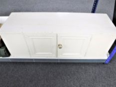 An antique pine double door cupboard