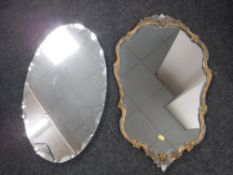 An ornate gilt framed mirror together with an early twentieth century frameless mirror