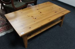 A pine two tier low coffee table