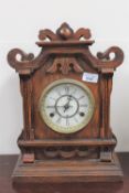 An oak cased eight day half hour strike mantle clock