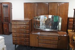A four piece mid twentieth century bedroom suite in walnut finish