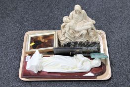 A tray of religious figures,