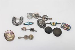 A group of Victorian and later silver brooches,