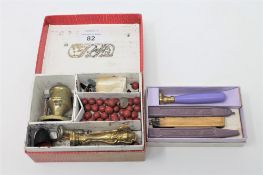 A sealing wax set to include stampers, wax and brass candlestick,