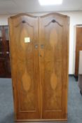 A figured walnut double door wardrobe together with a Queen Anne style dressing table