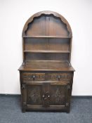 A carved oak double door Dutch style dresser