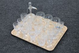 An etched glass decanter together with assorted glass